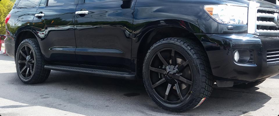 Toyota Sequoia with Blackout Rims and Mud Tires